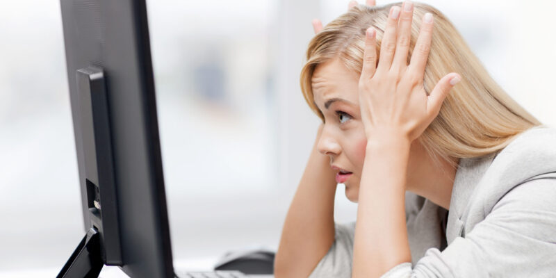 stressed woman with computer picture of stressed businesswoman with computer at work